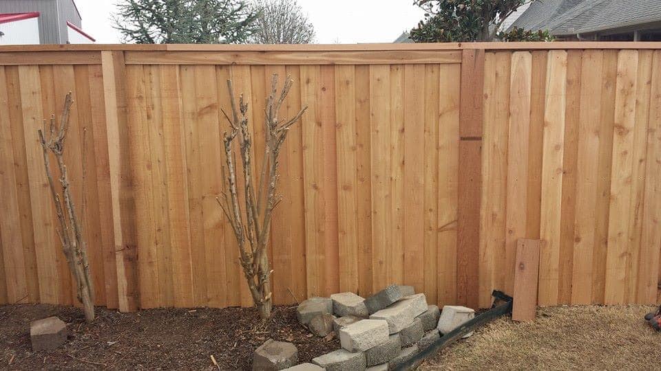 Board-on-board fence with walk gate by Lorett's Remodeling and Construction in Tulsa, OK