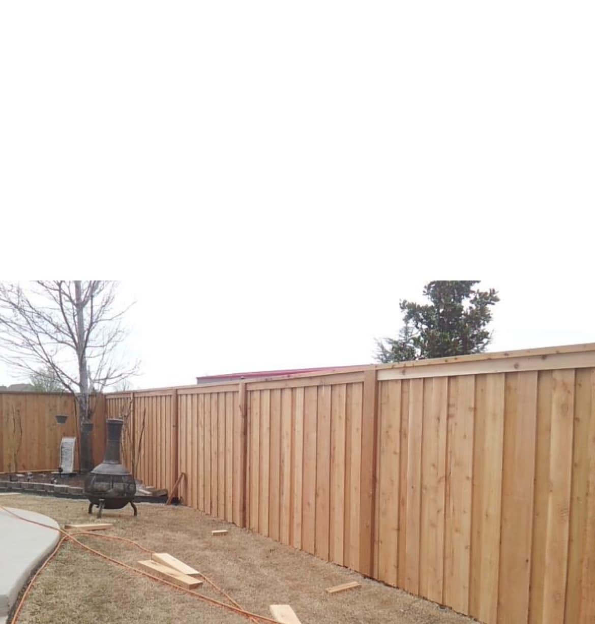 Wood privacy fence in a backyard by Lorett's Remodeling and Construction in Tulsa, OK