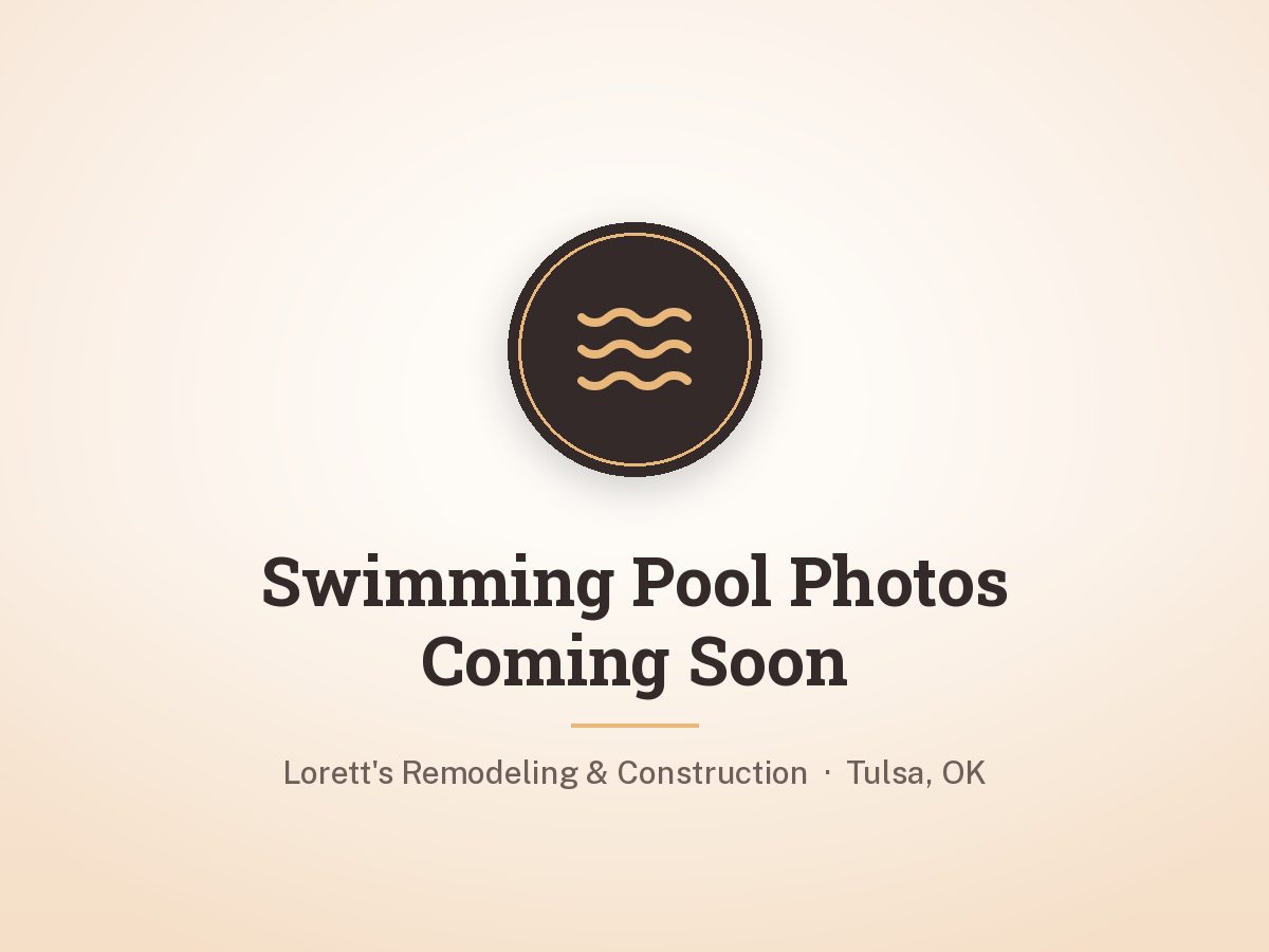Backyard swimming pool with concrete deck by Lorett's Remodeling and Construction in Tulsa, OK